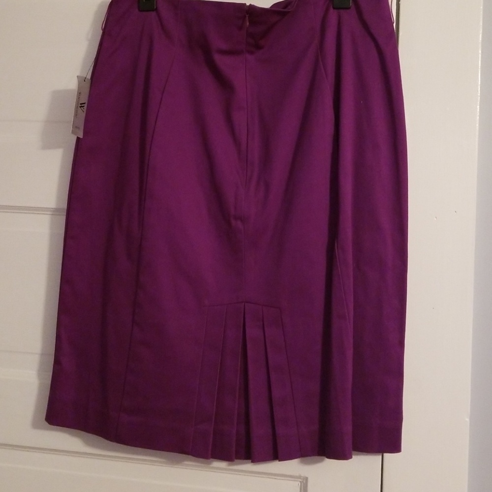 Rich purple skirt with back kick pleat.